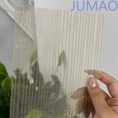 Los paneles de vidrio laminado de malla decorativa para muebles aportan calidez y brillo a los interiores